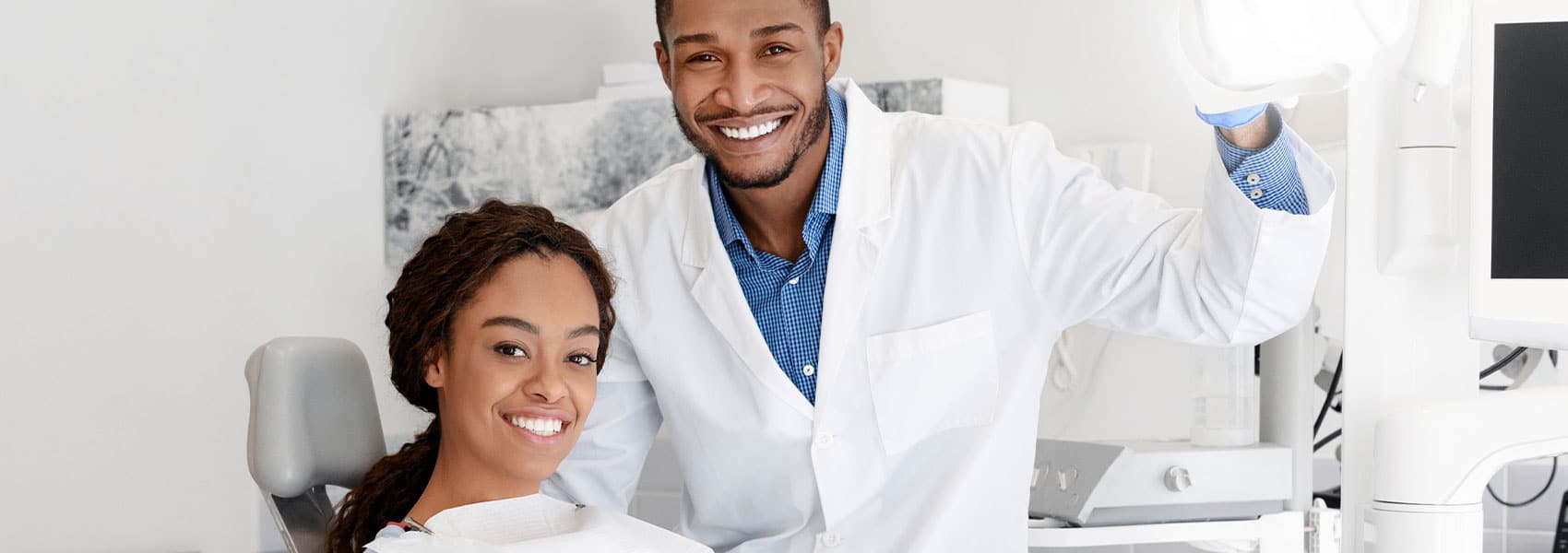 Dentist and patient smiling