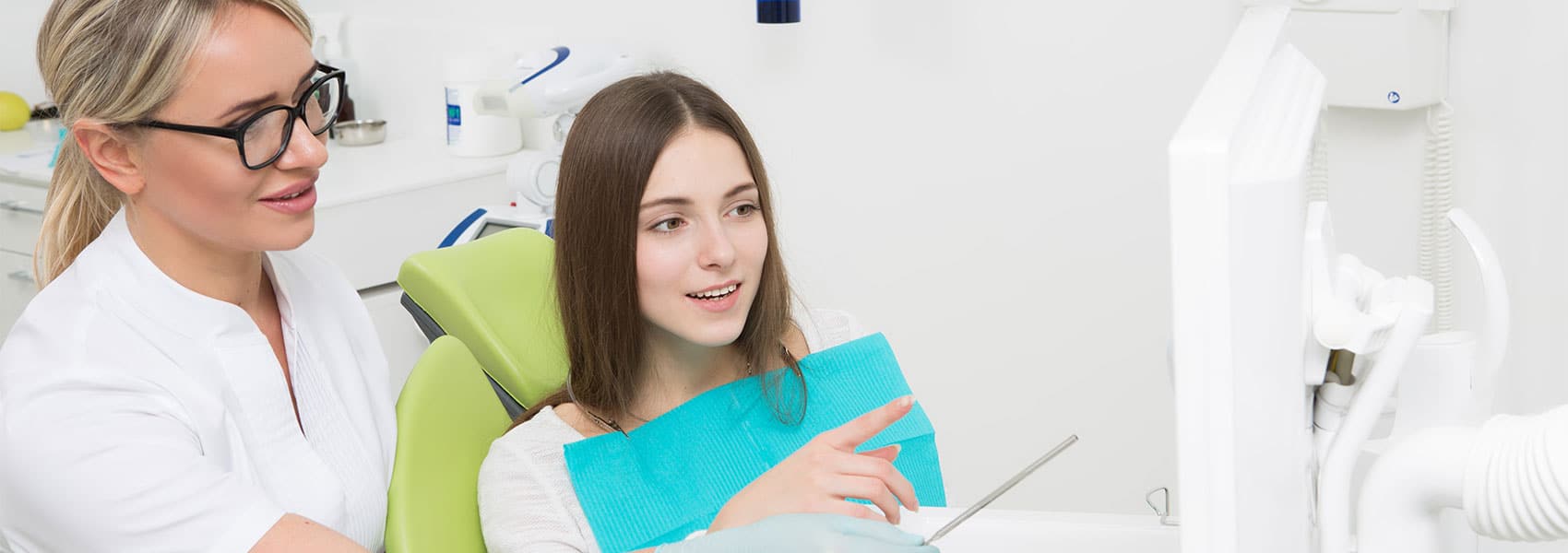 Dentist explaining about the treatments for patient