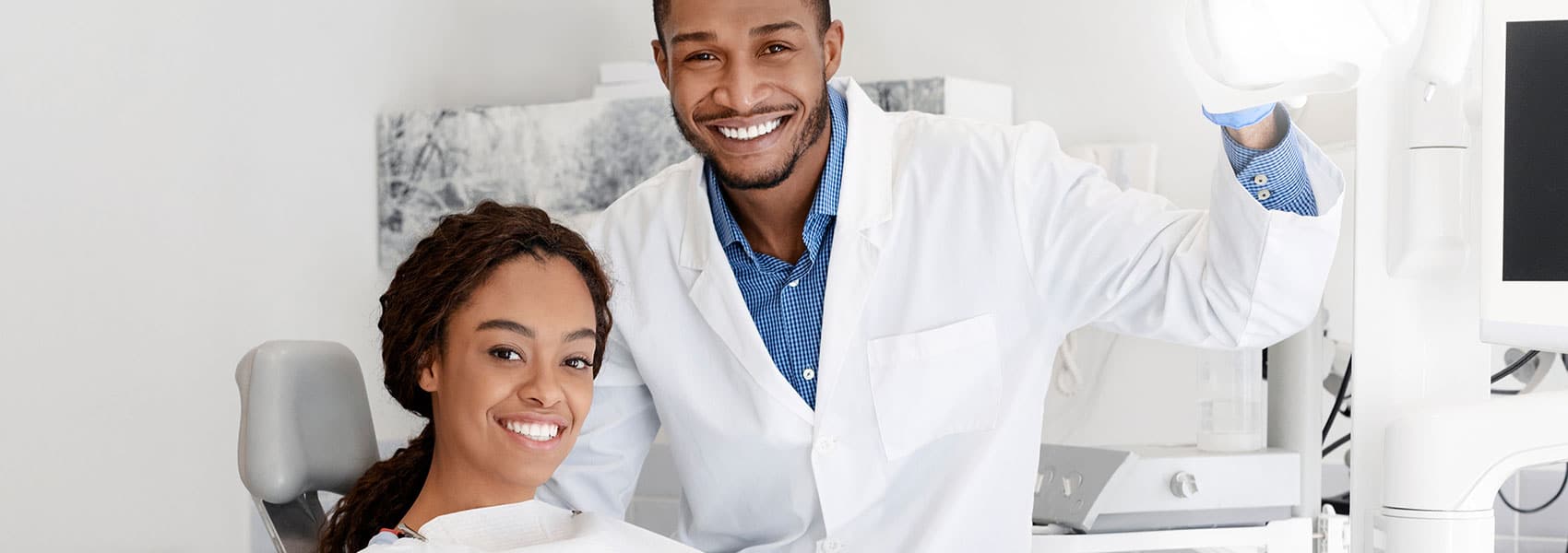 Dentist and patient smiling